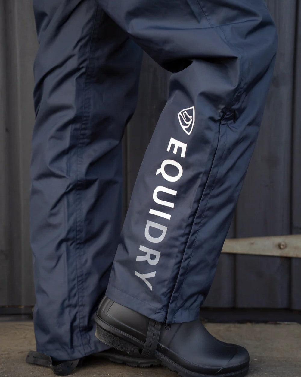 Navy coloured Equidry Mens Fleece Lined Waterproof Trousers on outdoor background 