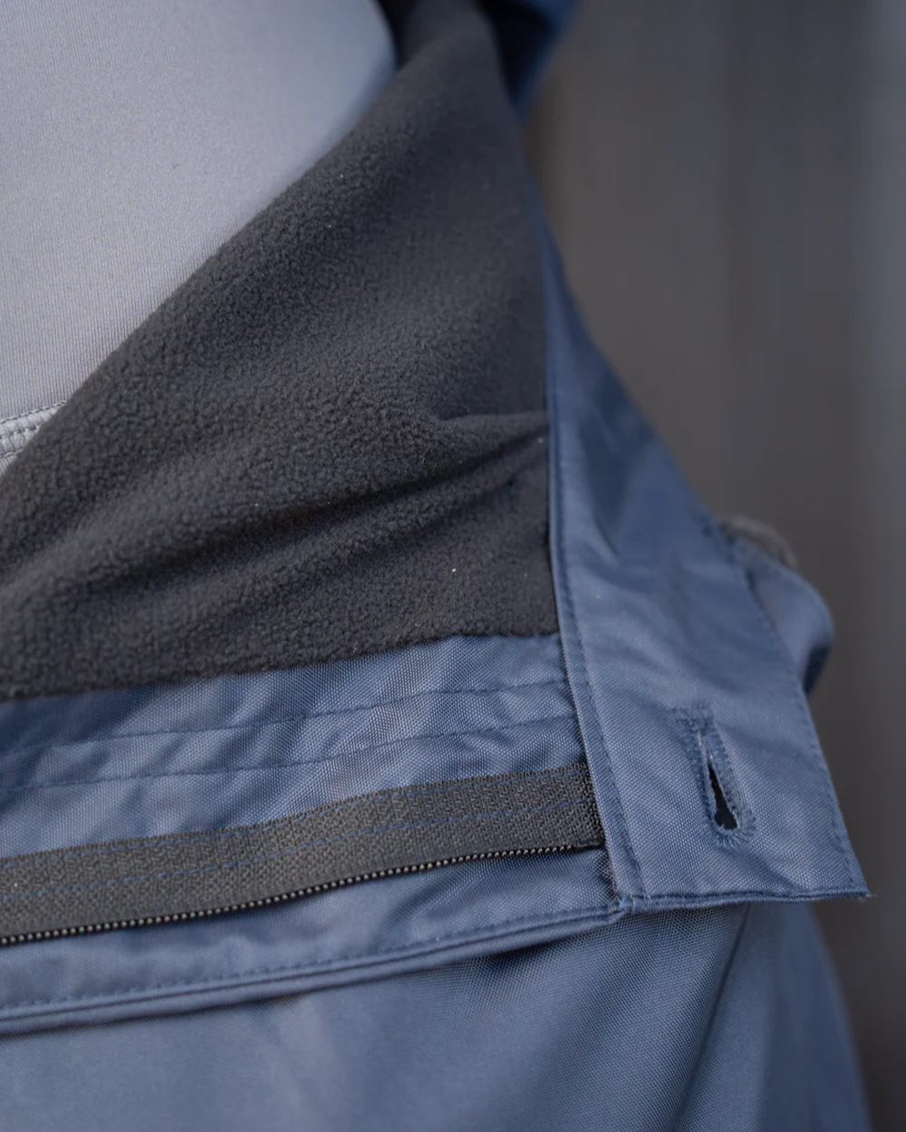 Navy coloured Equidry Mens Fleece Lined Waterproof Trousers on outdoor background 