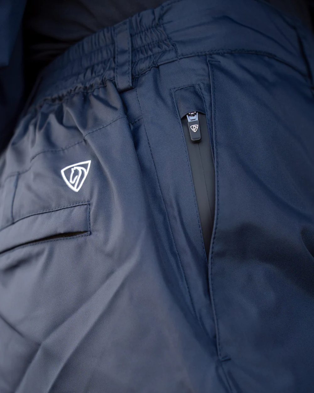Navy coloured Equidry Mens Fleece Lined Waterproof Trousers on outdoor background 