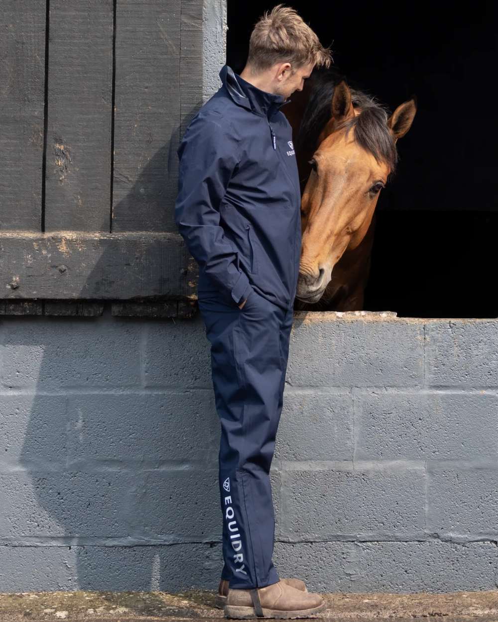 Navy coloured Equidry Mens Fleece Lined Waterproof Trousers on outdoor background 