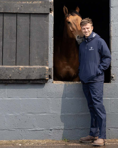 Navy coloured Equidry Mens Unlined Waterproof Trousers on outdoor background 