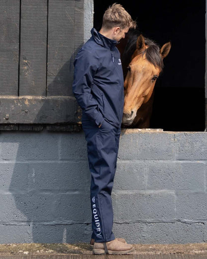Navy coloured Equidry Mens Unlined Waterproof Trousers on outdoor background 