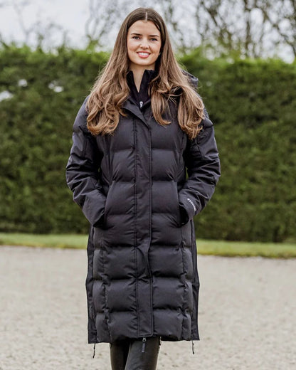 Black coloured Equidry Thora Waterproof Riding Puffer Coat With Hood on outdoor background 