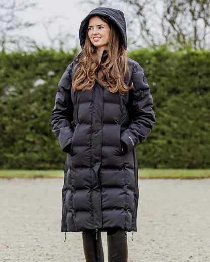 Black coloured Equidry Thora Waterproof Riding Puffer Coat With Hood on outdoor background 