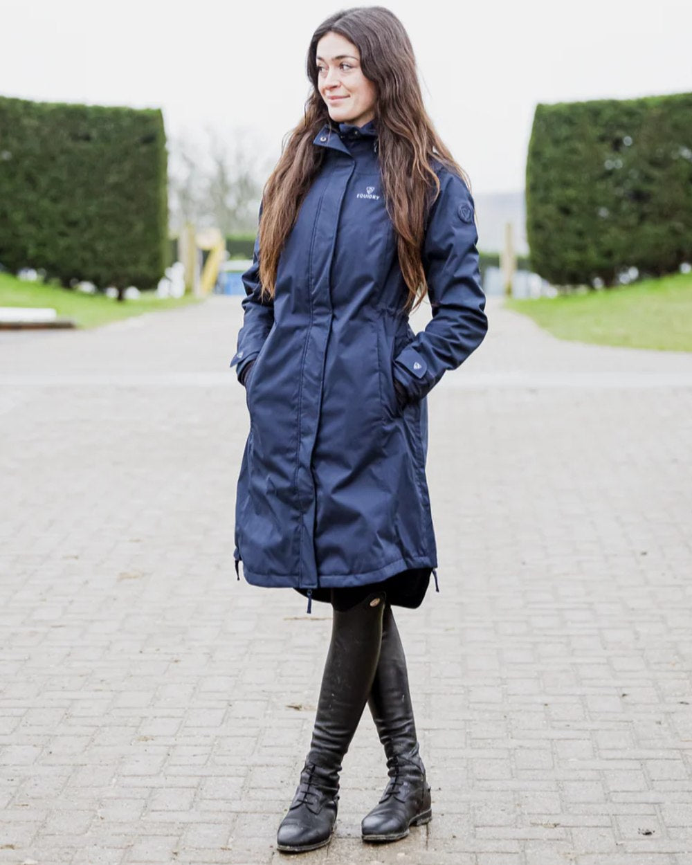 Navy coloured Equidry Womens Bronte Riding Coat on outdoor background 