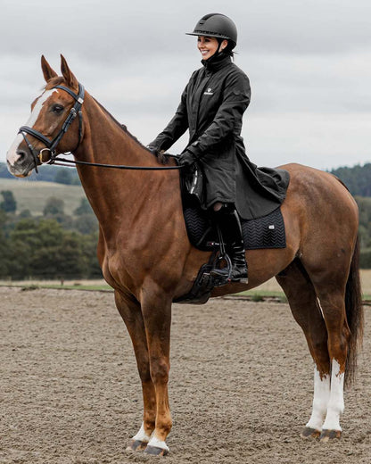 Black Coloured Equidry Womens Bronte Riding Coat With Removable Hood on outdoor background 