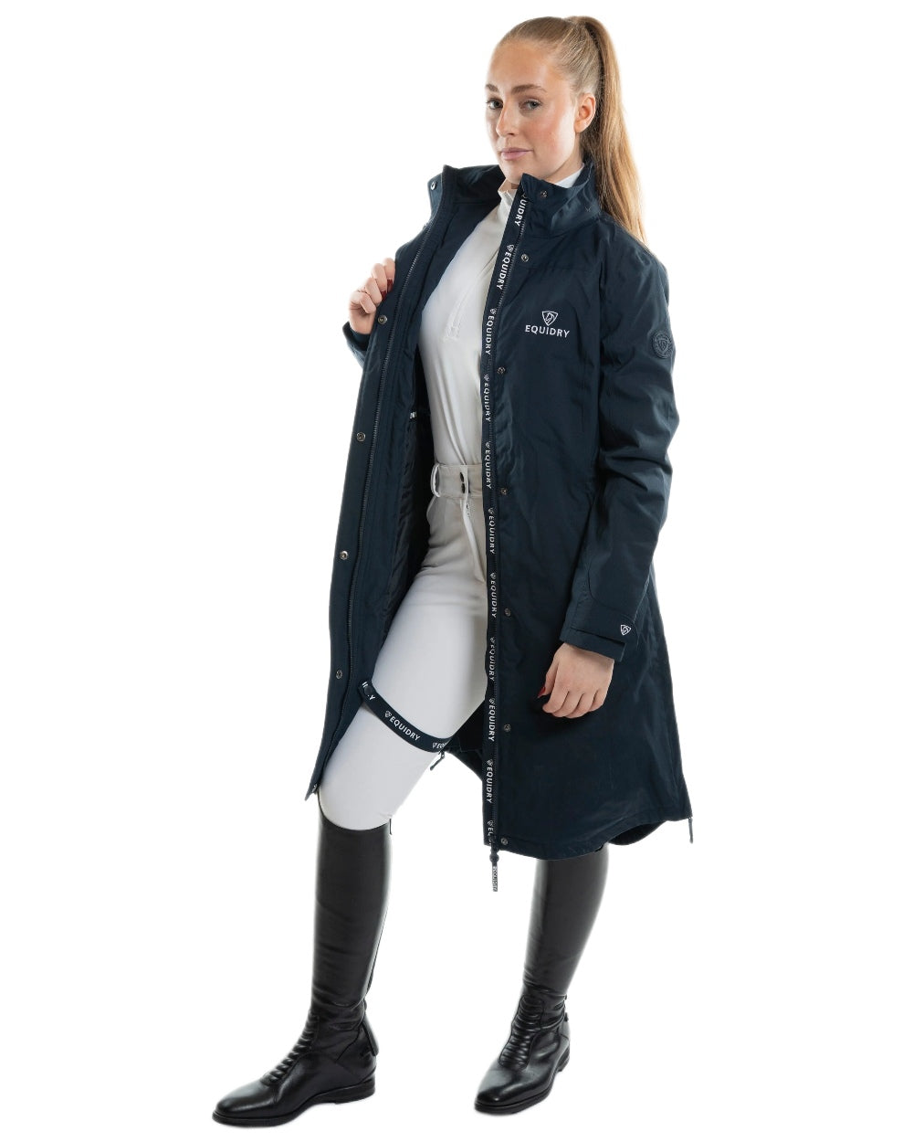 Navy Coloured Equidry Womens Bronte Riding Coat With Removable Hood on outdoor background 