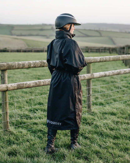 Black coloured Equidry Womens Equimac Evolution Jacket on farm background  