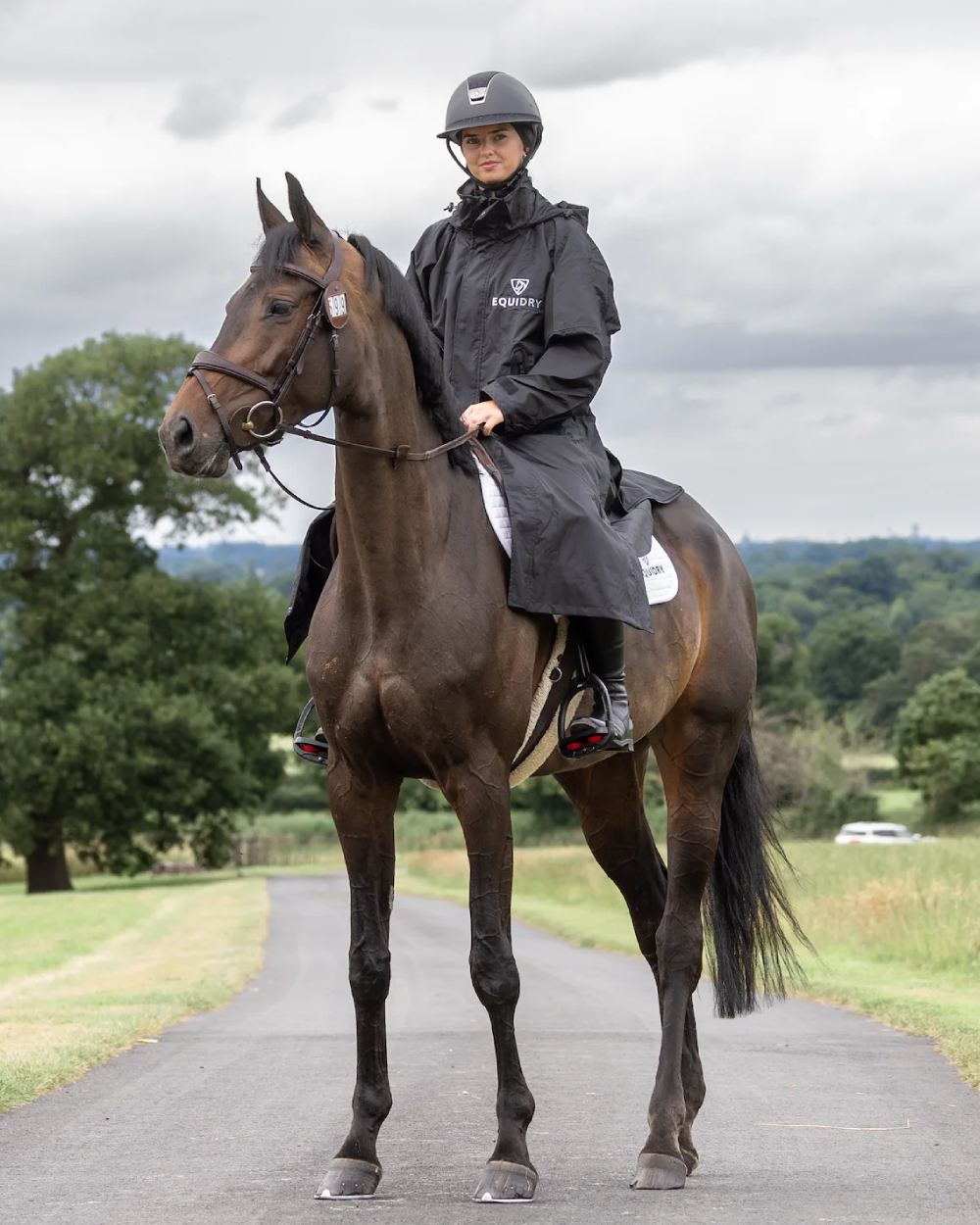 Black coloured Equidry Womens Equimac Evolution Jacket on street background  