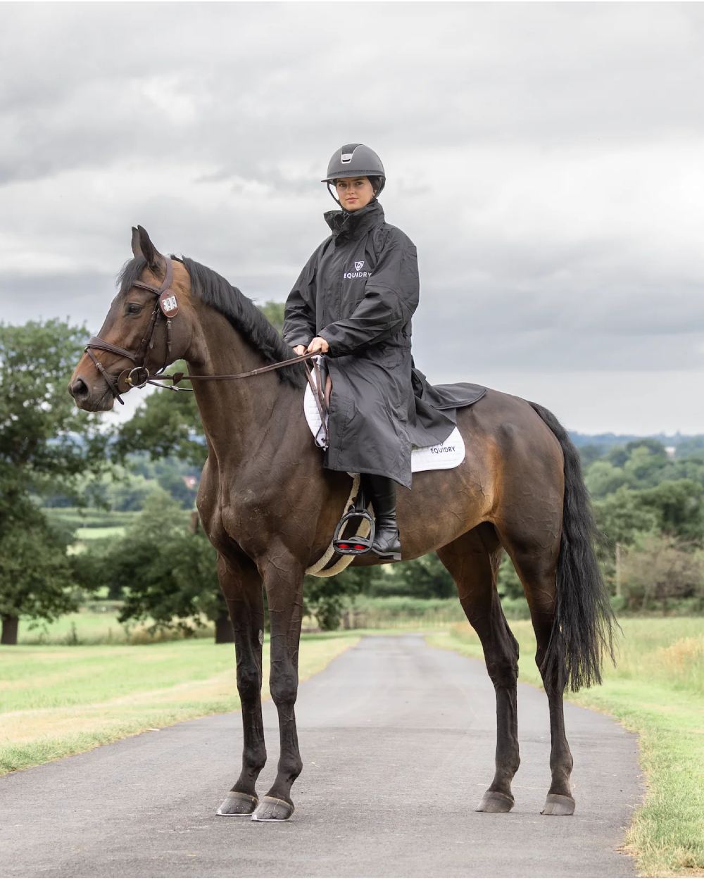 Black coloured Equidry Womens Equimac Evolution Jacket on farm background  