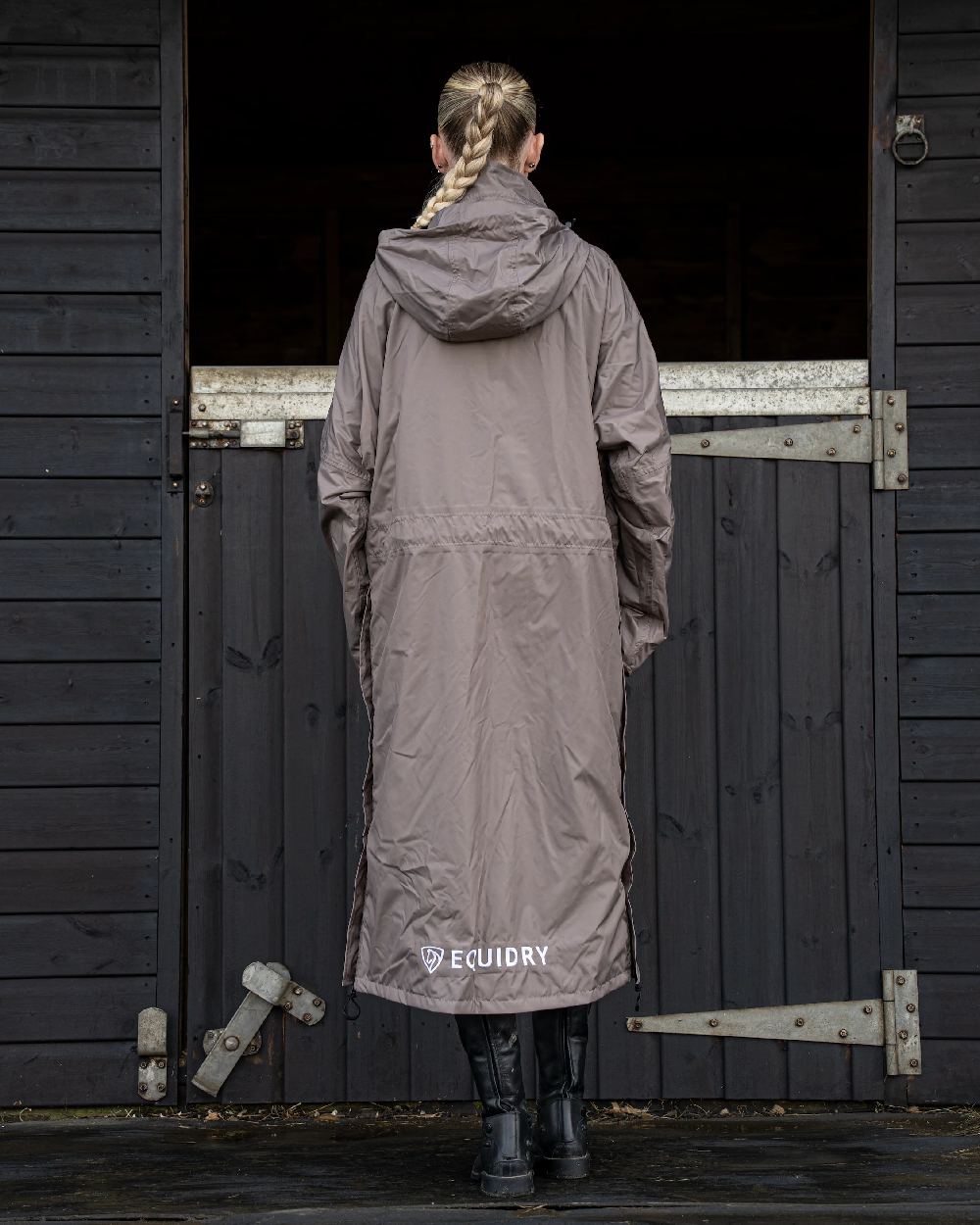 Mocha coloured Equidry Womens Equimac Evolution Jacket on Stable background  