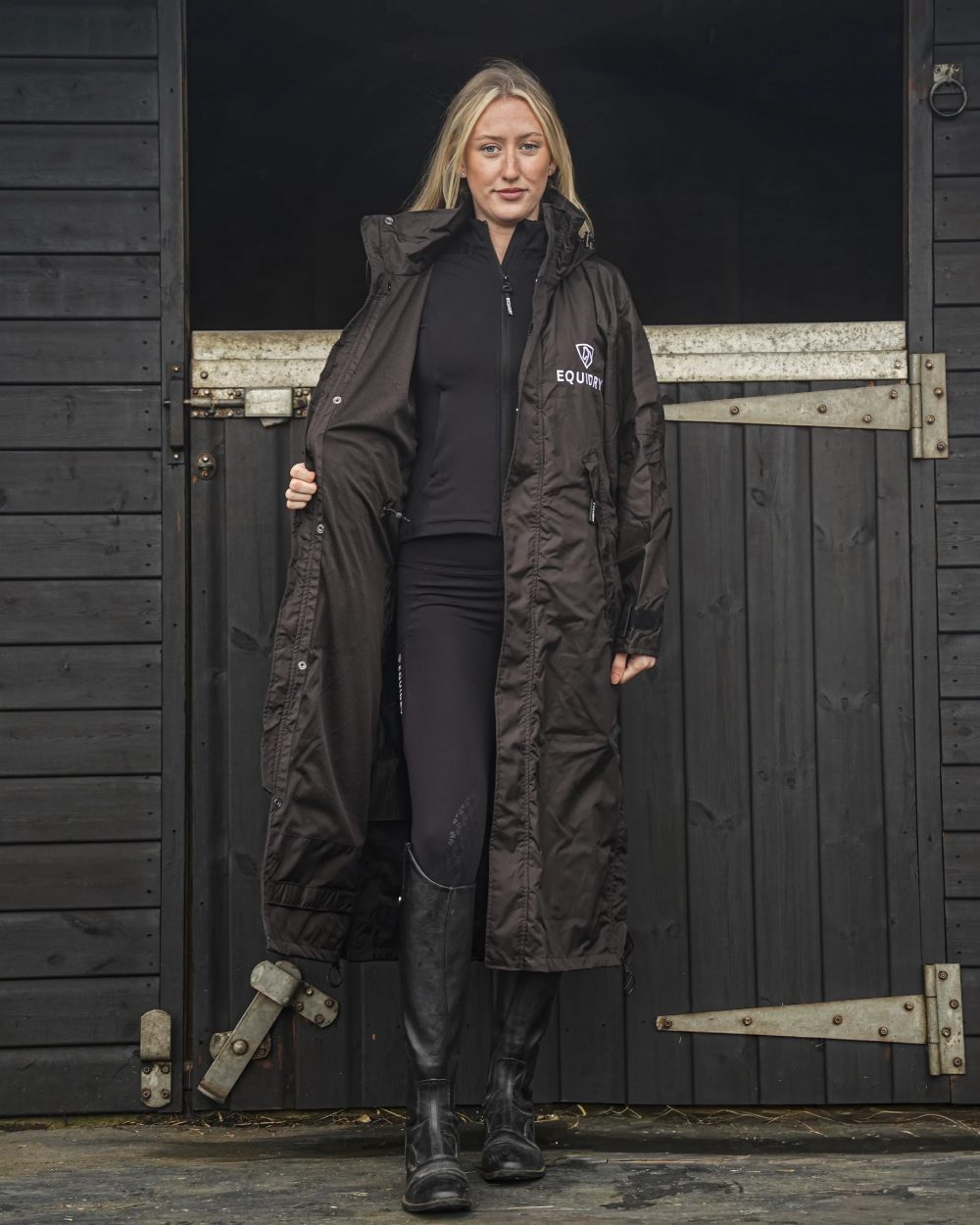 Rich Brown coloured Equidry Womens Equimac Evolution Jacket on stable background  