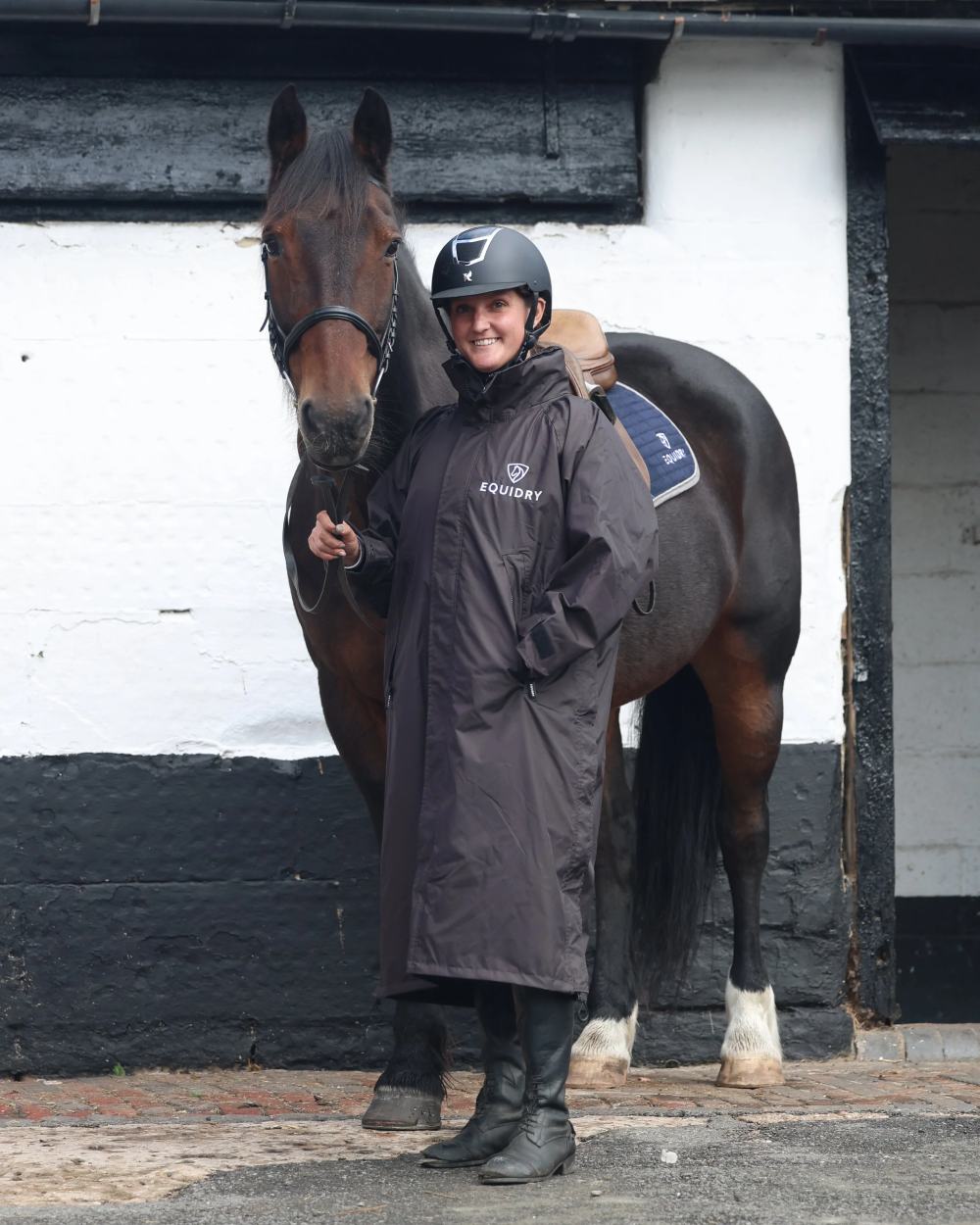 Rich Brown coloured Equidry Womens Equimac Evolution Jacket on stable background  