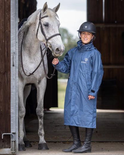 Steel Blue Navy coloured Equidry Womens Equimac Evolution Jacket on stable background  