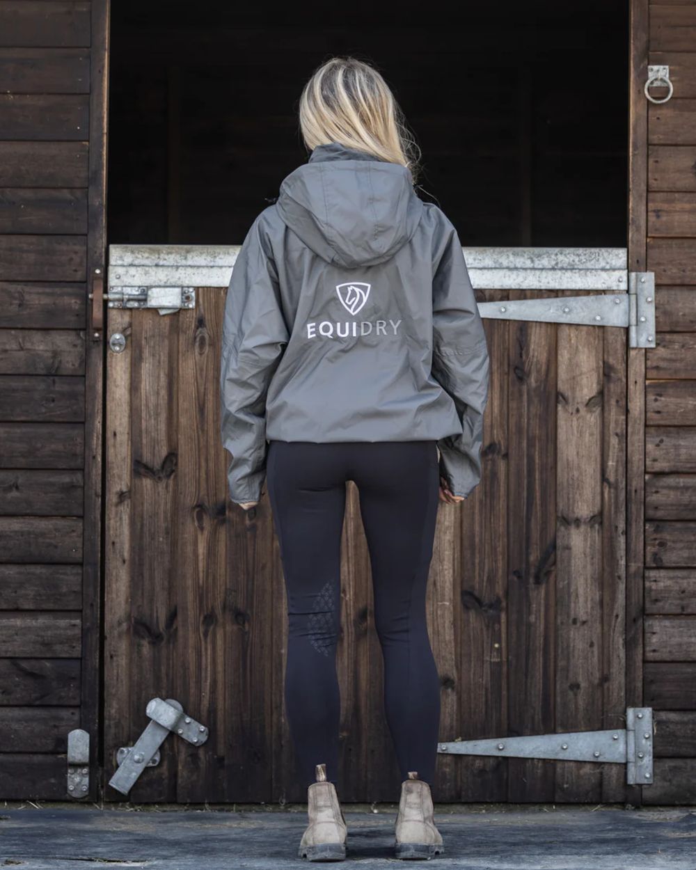 Charcoal coloured Equidry Womens Equimac Shortie With Stowaway Hood on outdoor background 