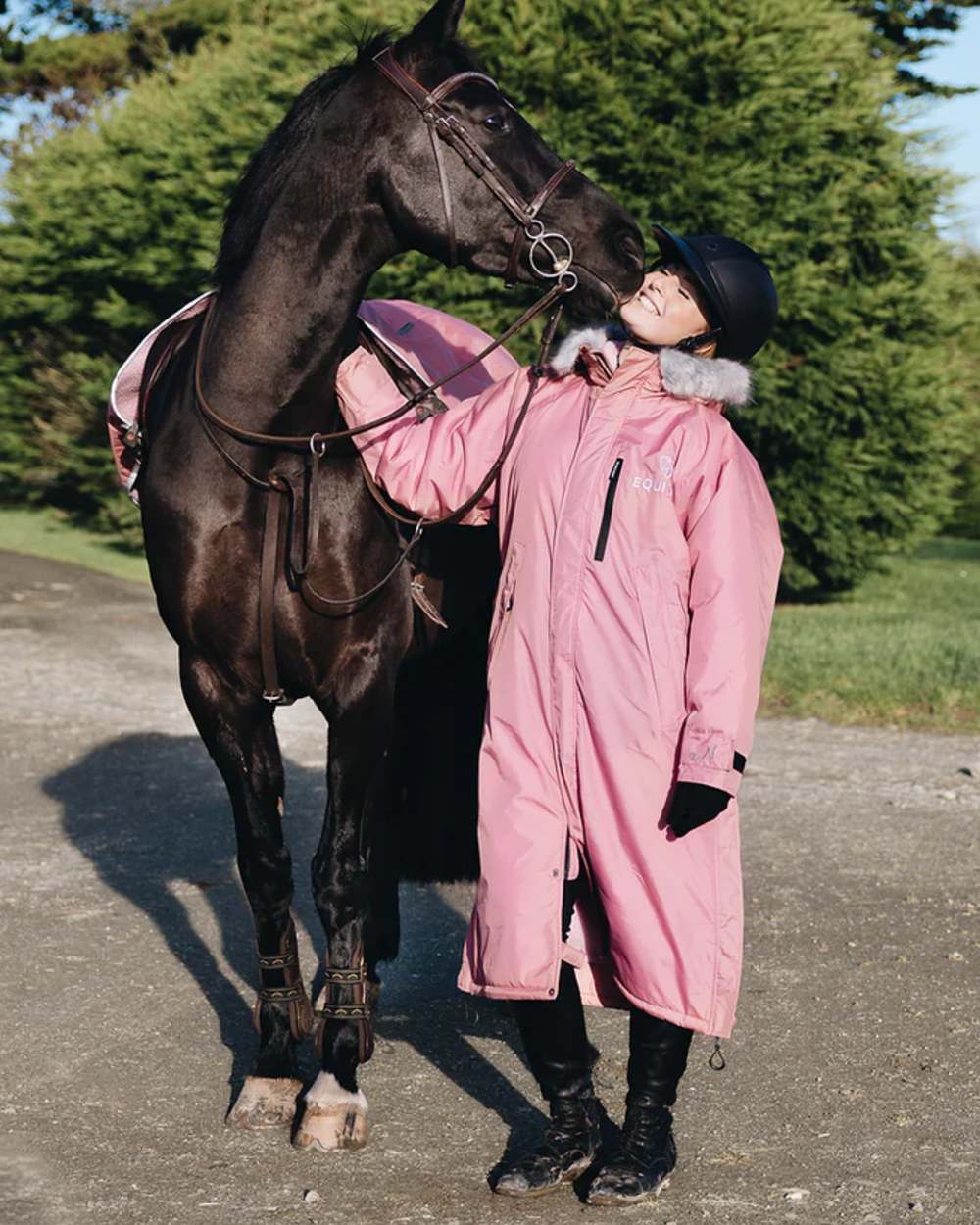 Dusky Pink coloured Equidry Womens Evolution Thick Fleece With Fur Hood on street background 