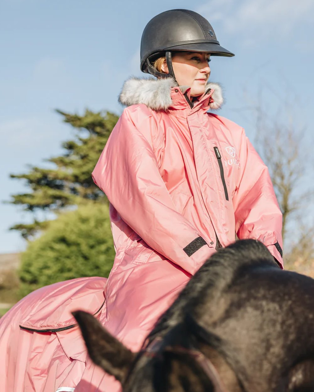 Dusky Pink coloured Equidry Womens Evolution Thick Fleece With Fur Hood on sky background 