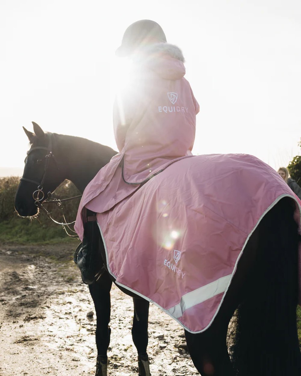 Dusky Pink coloured Equidry Womens Evolution Thick Fleece With Fur Hood on farm background 