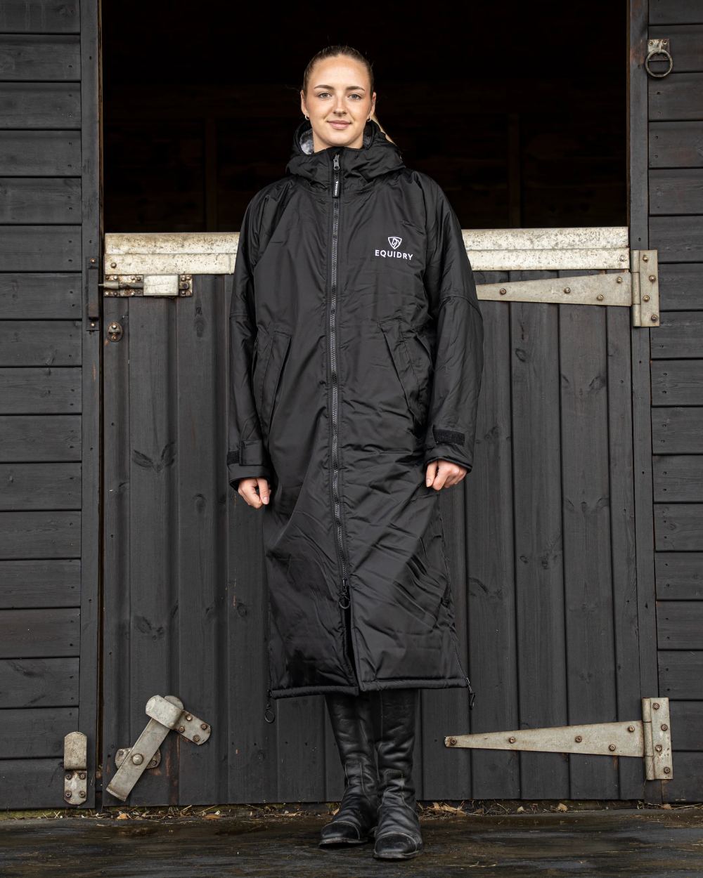 Black coloured Equidry Womens Original All Rounder Waterproof Coat on outdoor background 