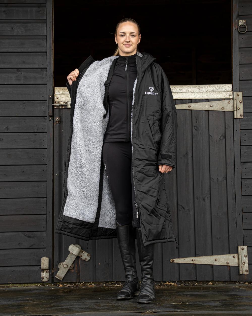 Black coloured Equidry Womens Original All Rounder Waterproof Coat on outdoor background 