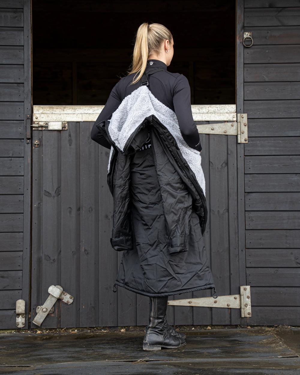 Black coloured Equidry Womens Original All Rounder Waterproof Coat on outdoor background 