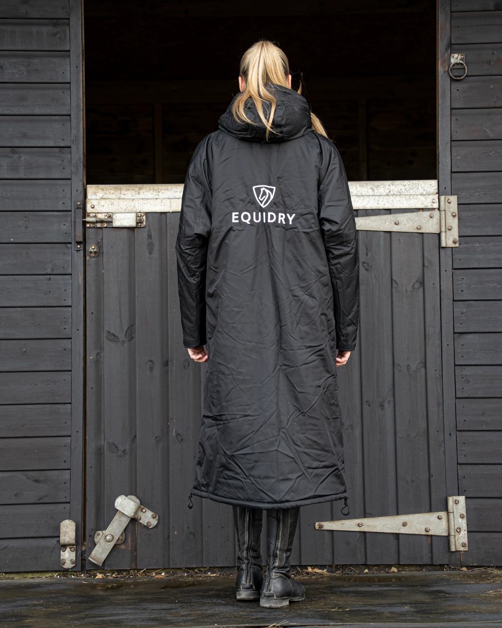 Black coloured Equidry Womens Original All Rounder Waterproof Coat on outdoor background 