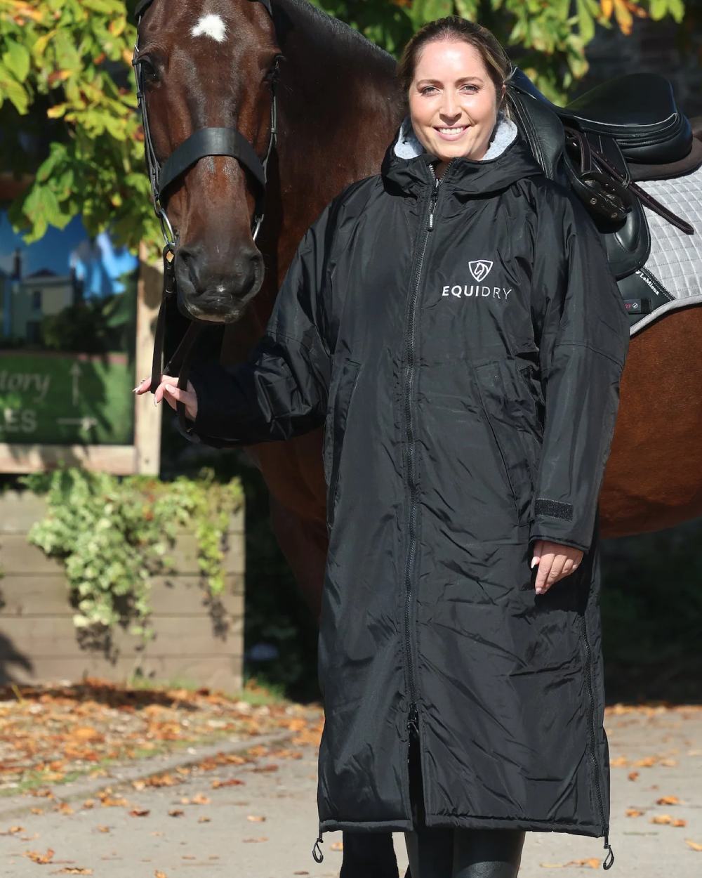 Black coloured Equidry Womens Original All Rounder Waterproof Coat on outdoor background 