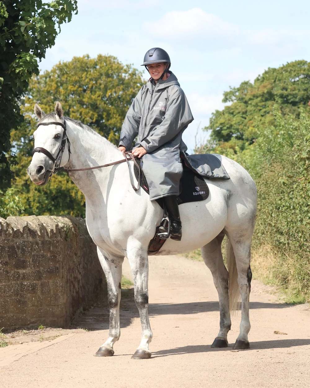 Charcoal Pink coloured Equidry Womens Original All Rounder Waterproof Coat on outdoor background 
