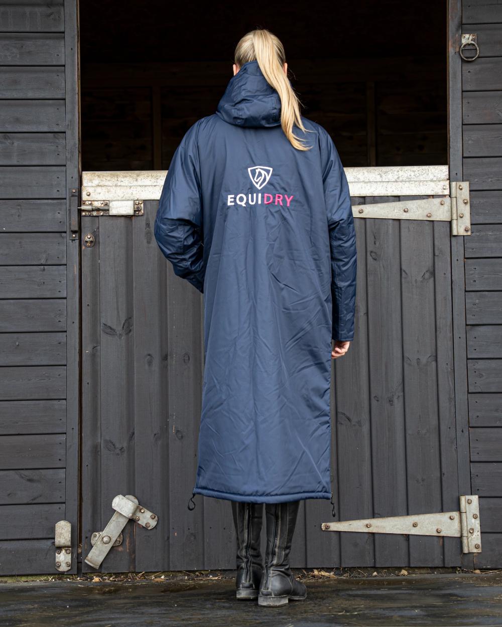 Navy Raspberry coloured Equidry Womens Original All Rounder Waterproof Coat on outdoor background 