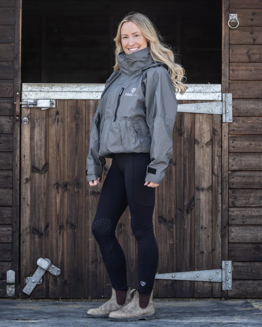 Charcoal Grey coloured Equidry Womens Shortie Thin Fleece Jacket With Stowaway Hood on outdoor background 