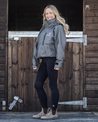 Charcoal Grey coloured Equidry Womens Shortie Thin Fleece Jacket With Stowaway Hood on outdoor background 