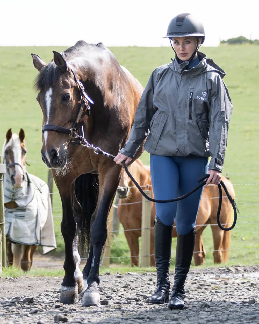 Charcoal Grey coloured Equidry Womens Shortie Thin Fleece Jacket With Stowaway Hood on outdoor background 