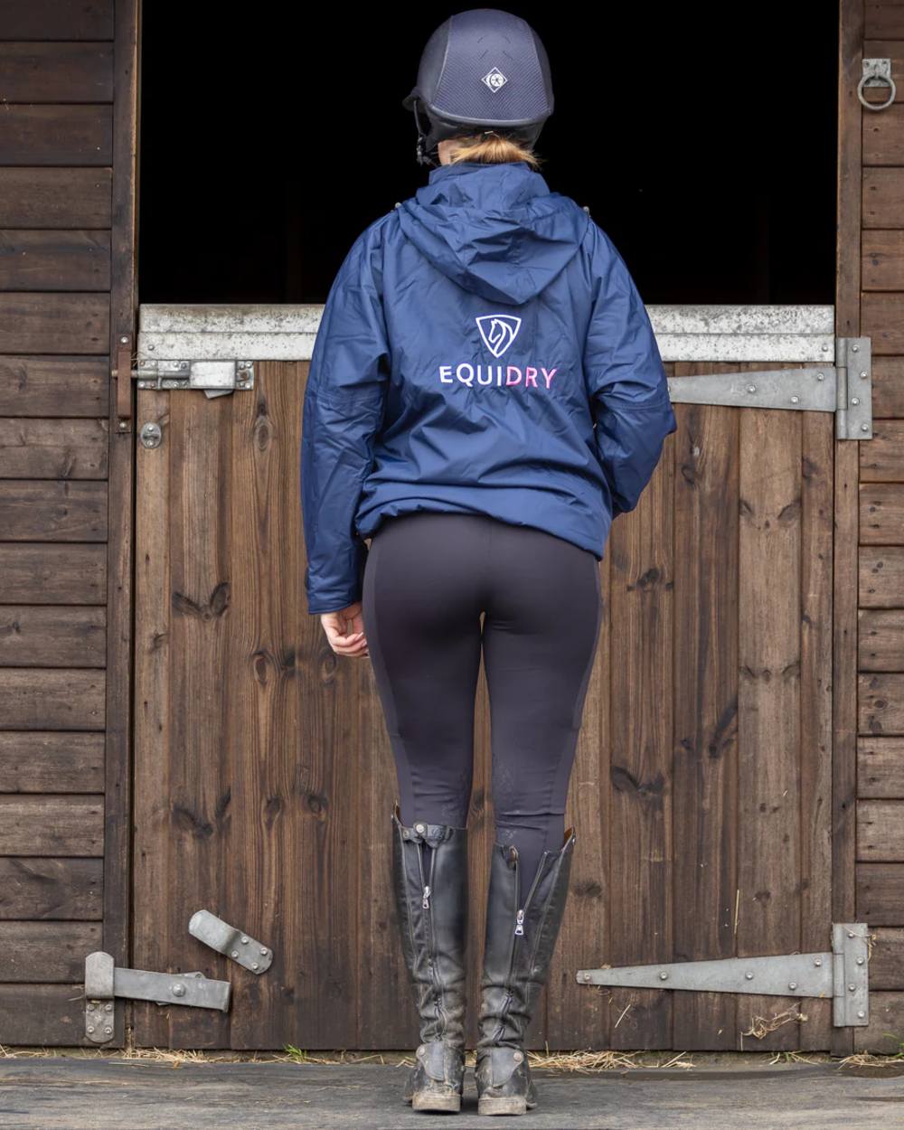 Navy Penelope Pink Equidry Womens Shortie Thin Fleece Jacket With Stowaway Hood on outdoor background 