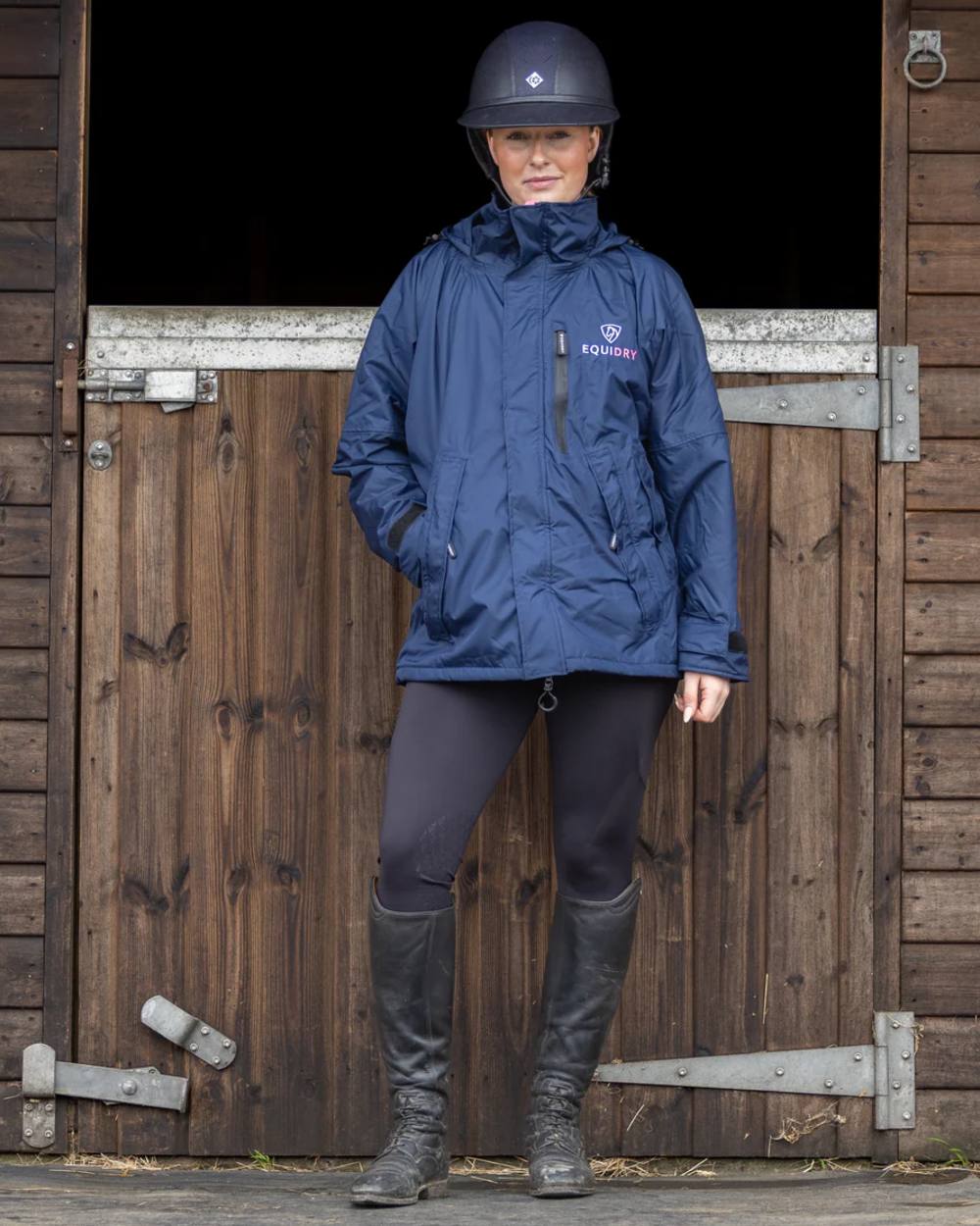 Navy Penelope Pink Equidry Womens Shortie Thin Fleece Jacket With Stowaway Hood on outdoor background 