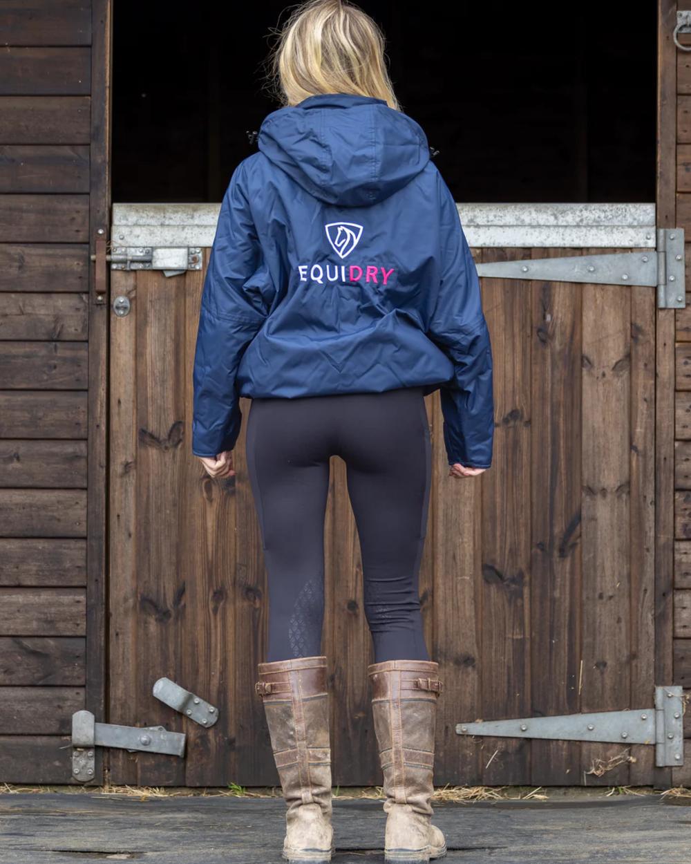 Navy Raspberry Equidry Womens Shortie Thin Fleece Jacket With Stowaway Hood on outdoor background 