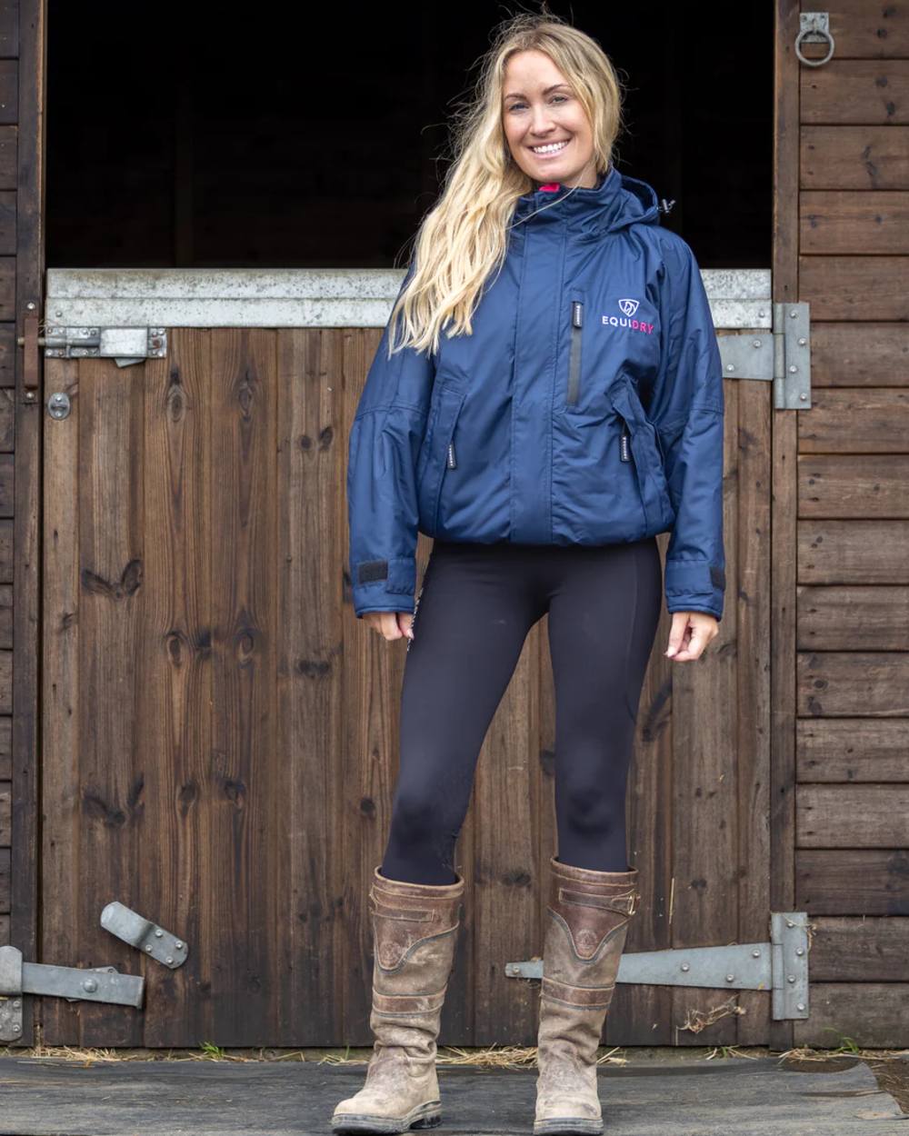 Navy Raspberry Equidry Womens Shortie Thin Fleece Jacket With Stowaway Hood on outdoor background 