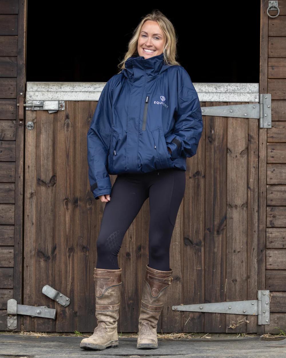 Navy coloured Equidry Womens Shortie Thin Fleece Jacket With Stowaway Hood on outdoor background 
