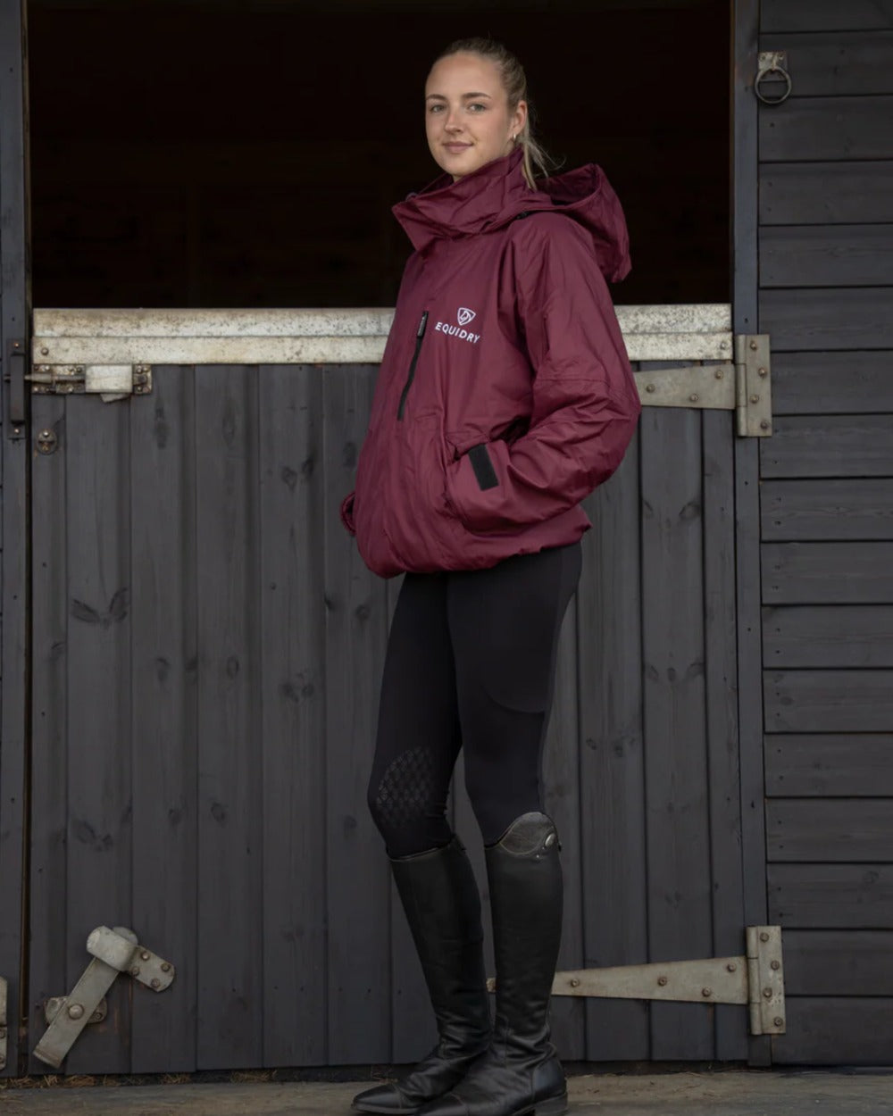 Plum Equidry Womens Shortie Thin Fleece Jacket With Stowaway Hood on outdoor background 