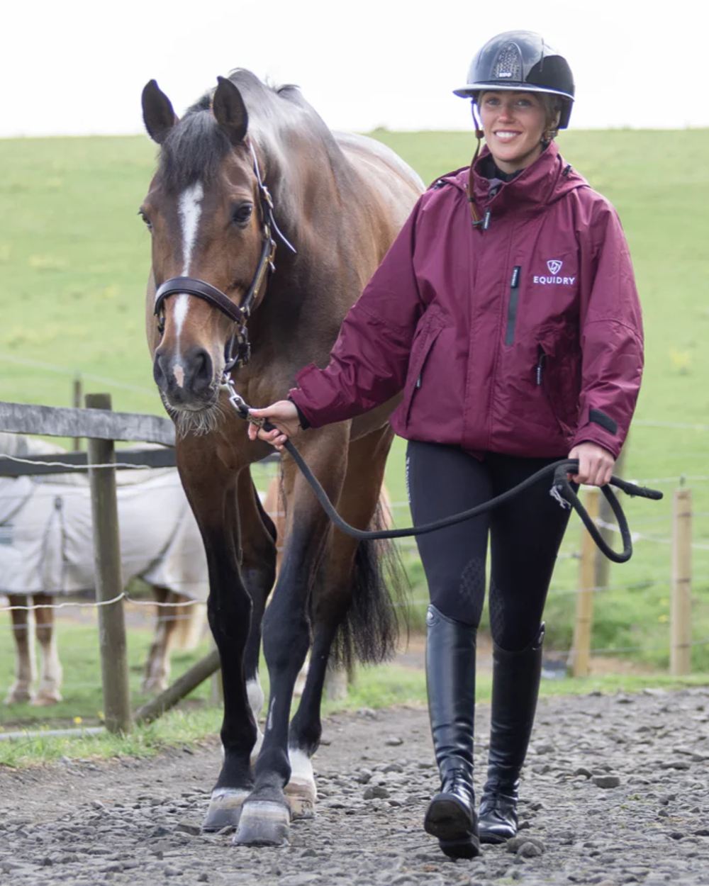 Plum Equidry Womens Shortie Thin Fleece Jacket With Stowaway Hood on outdoor background 