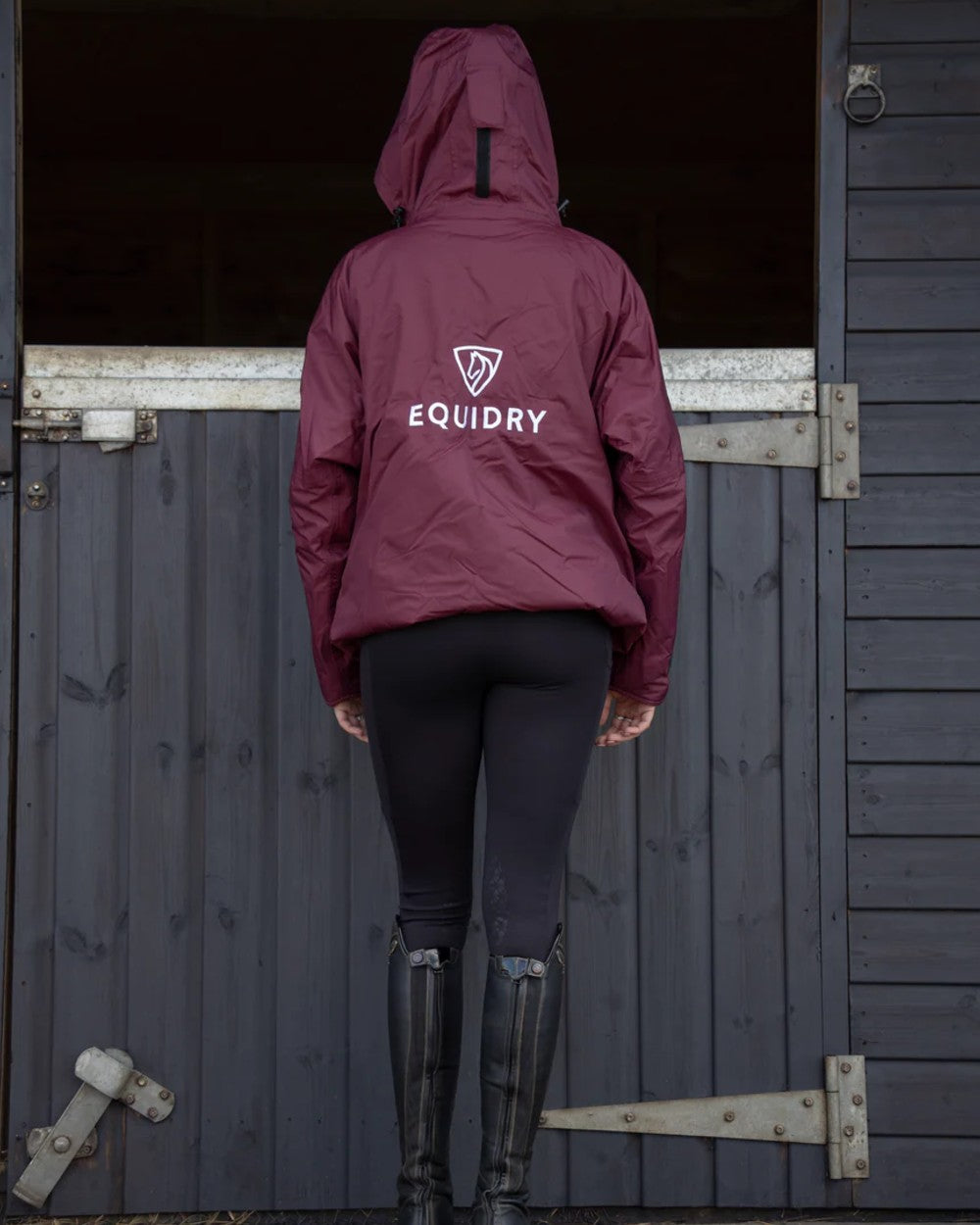 Plum Equidry Womens Shortie Thin Fleece Jacket With Stowaway Hood on outdoor background 