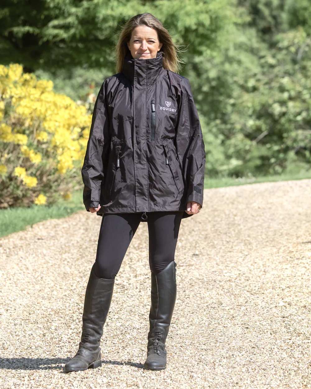 Rich Brown Equidry Womens Shortie Thin Fleece Jacket With Stowaway Hood on outdoor background 