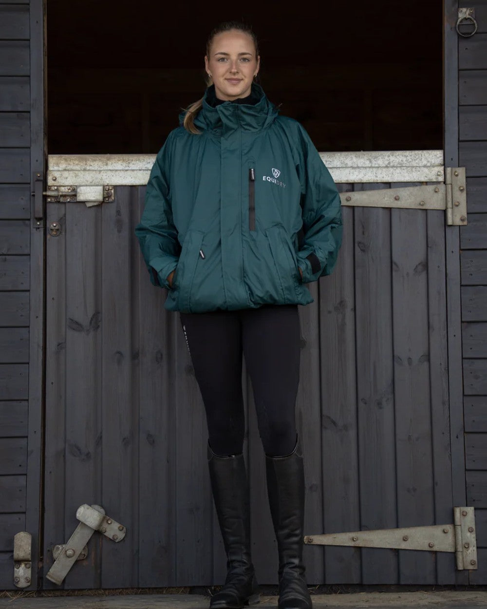 Teal Equidry Womens Shortie Thin Fleece Jacket With Stowaway Hood on outdoor background 