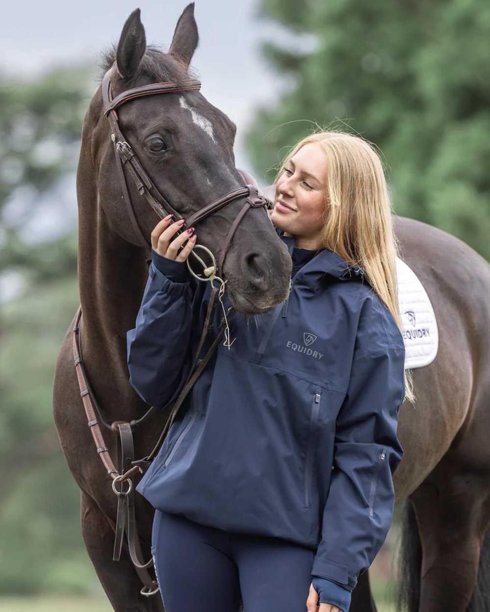 Navy coloured Equidry Womens Storm Smock With Velour Lining on outdoor background 