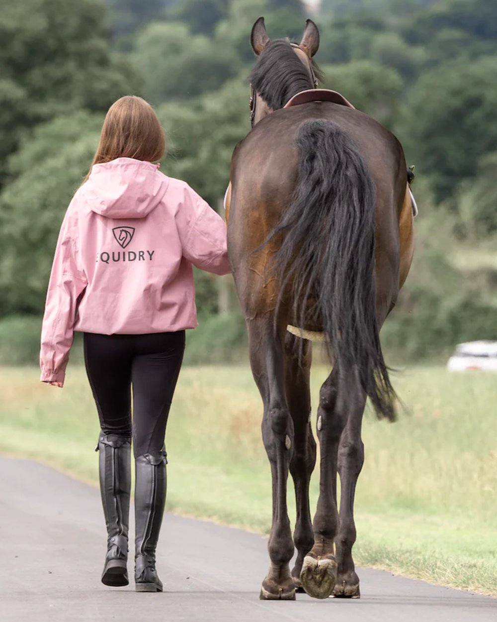 Pink coloured Equidry Womens Storm Smock With Velour Lining on outdoor background 