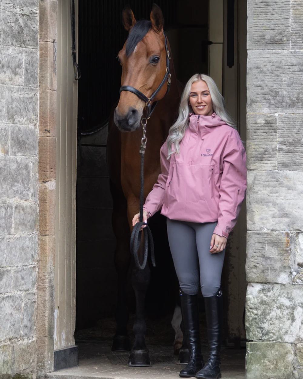 Pink coloured Equidry Womens Storm Smock With Velour Lining on outdoor background 