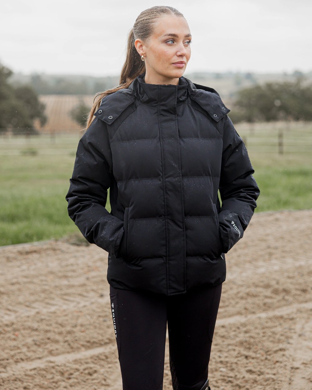 Black Coloured Equidry Womens Talia Waterproof Puffer Jacket on outdoor background 
