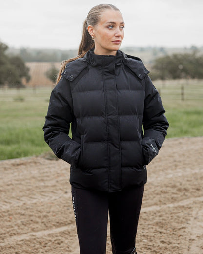 Black Coloured Equidry Womens Talia Waterproof Puffer Jacket on outdoor background 
