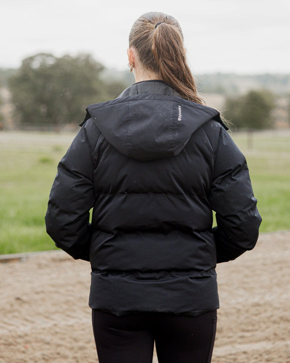 Black Coloured Equidry Womens Talia Waterproof Puffer Jacket on outdoor background 