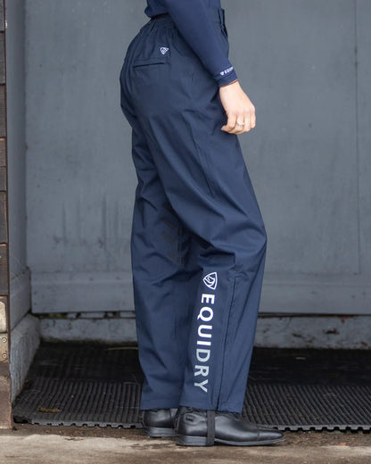 Navy coloured Equidry Womens Unlined Waterproof Trousers on outdoor background 