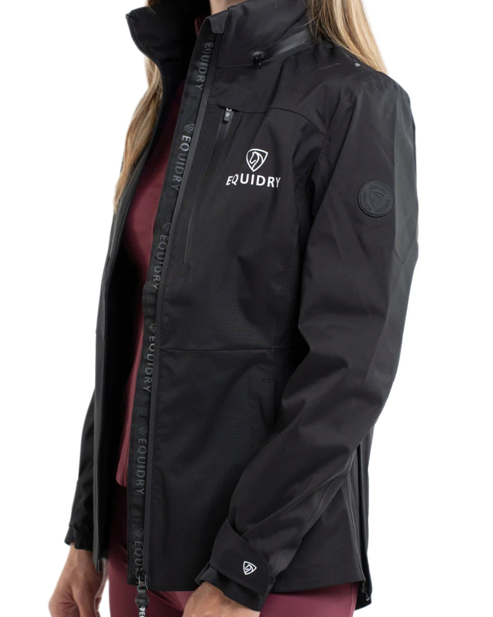 Black coloured Equidry Womens Varsha Jacket with Stowaway Hood on white background 
